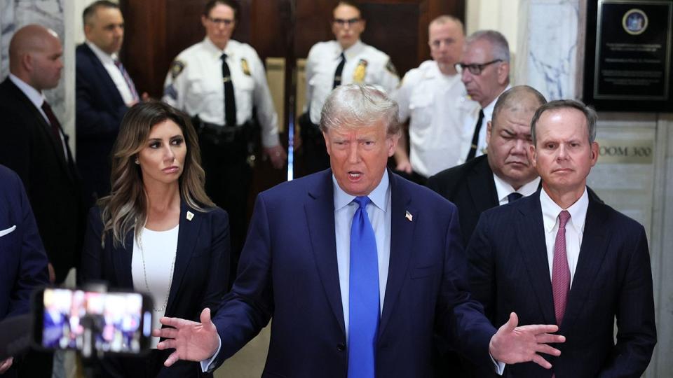 Former U.S. President Donald Trump speaks to the media as he arrives for the start of his civil fraud trial at New York State Supreme Court on October 02, 2023 in New York City. Former President Trump may be forced to sell off his properties after Justice Arthur Engoron canceled his business certificates and ruled that he committed fraud for years while building his real estate empire after being sued by Attorney General Letitia James, who is seeking $250 million in damages. The trial will determine how much he and his companies will be penalized for the fraud.