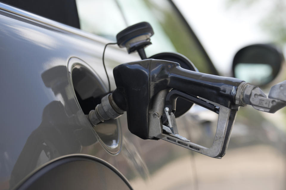 FILE - A motorist fills up a vehicle at a Shell gasoline station Sunday, June 18, 2023, in Englewood, Colo. High prices have left U.S. adults deeply pessimistic about the economy, with just 34% approving of Biden's leadership on the issue, according to a new poll from The Associated Press-NORC Center for Public Affairs. Based on follow-up interviews with poll respondents, they're far more aware of gasoline and grocery store prices than the details of President Joe Biden's policies. (AP Photo/David Zalubowski, File)