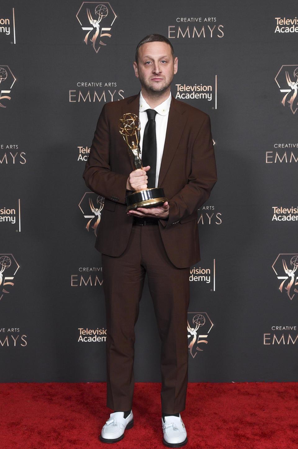 Tim Robinson poses with the award for outstanding actor in a short form comedy or drama series for "I Think You Should Leave With Tim Robinson" in the press room during night one of the Creative Arts Emmy Awards on Saturday, Jan. 6, 2024, at the Peacock Theater in Los Angeles. (Photo by Richard Shotwell/Invision/AP)