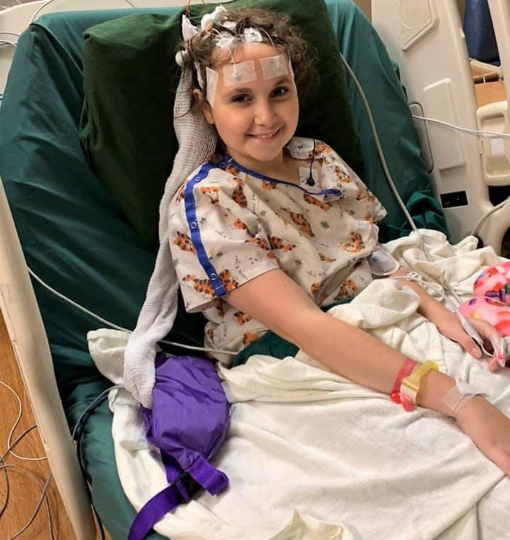 Ava Winner in bed at Akron Children's Hospital following a surgery for testing on a spot found on her brain. Ava was first diagnosed with cancer at age 9 in 2019. She was declared cancer free in April 2020, but it returned this past October.