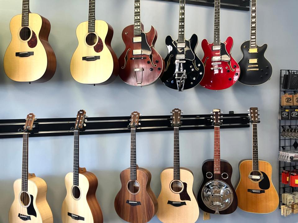 A wall of guitars hands inside Waynesboro Music. The new store will have its grand opening Saturday, Aug. 5, a the Colonnade Shopping Center, 520 W. Broad Street in Waynesboro.