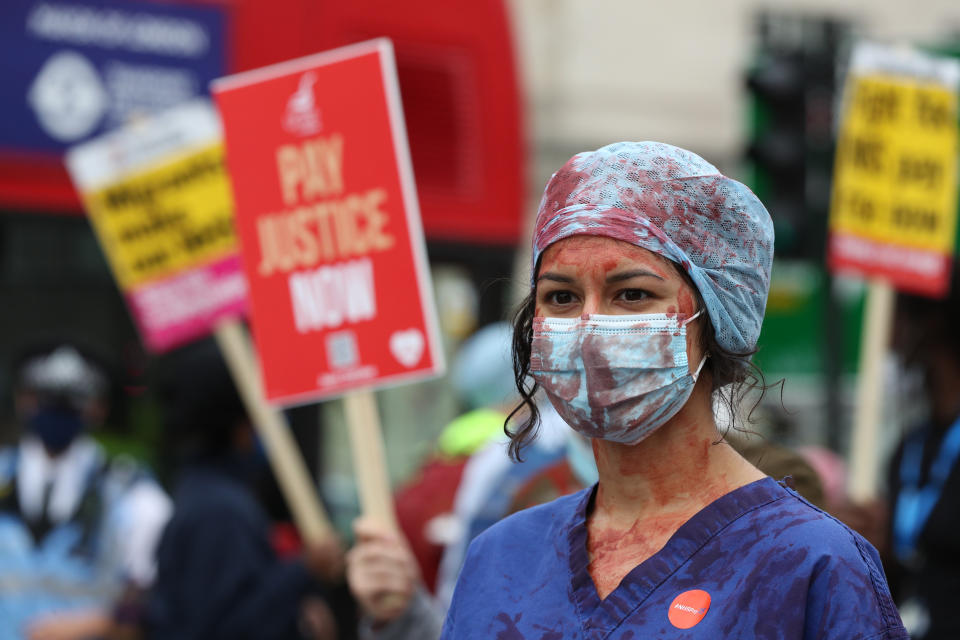 An NHS worker at St Thomas' Hospital, London, attending a rally to demand the government give them a 15 per cent pay rise.