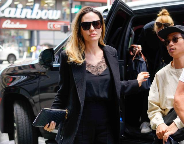 Angelina Jolie's Airport Attire Includes a Black Coat and a Celine