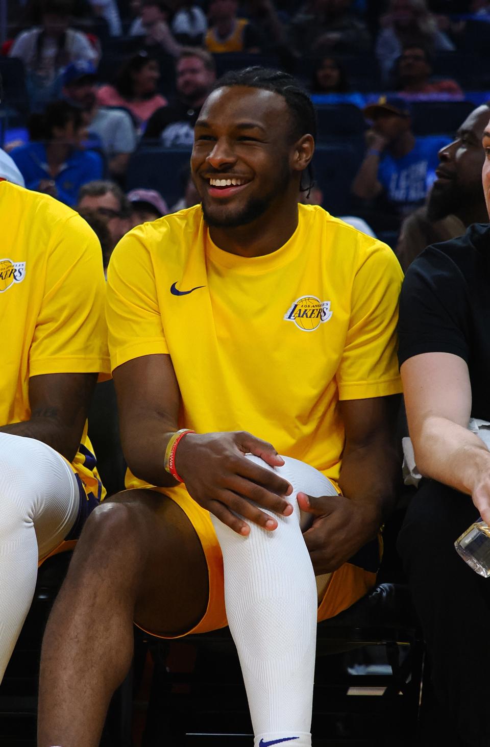 Jul 7, 2024; San Francisco, CA, USA; Los Angeles Lakers guard Bronny James Jr. (9) smiles on the bench with his hand on his knee during the fourth quarter against the Golden State Warriors at Chase Center. Mandatory Credit: Kelley L Cox-USA TODAY Sports