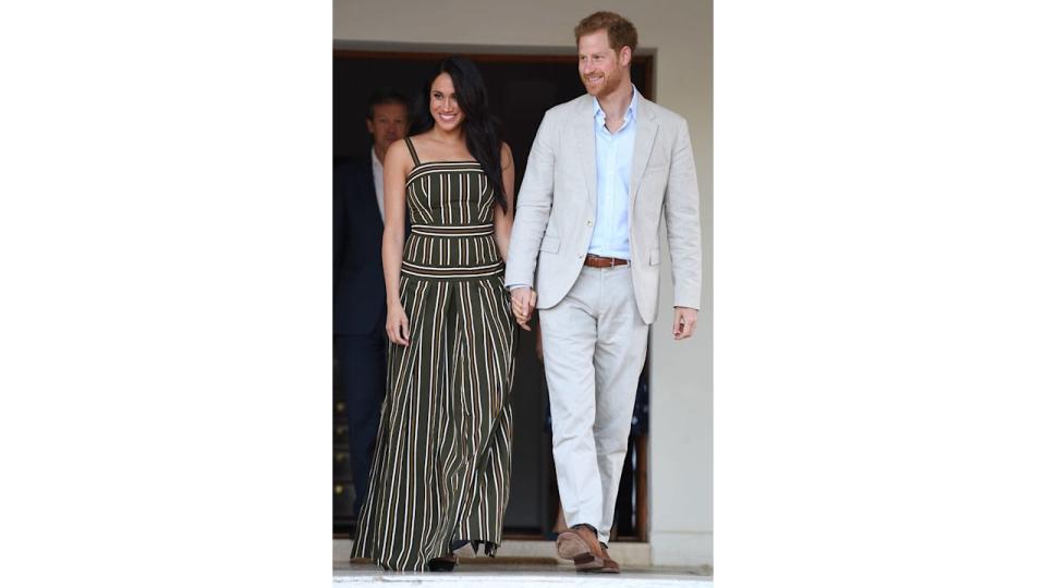 Prince Harry and Meghan Markle walking down steps in Cape Town