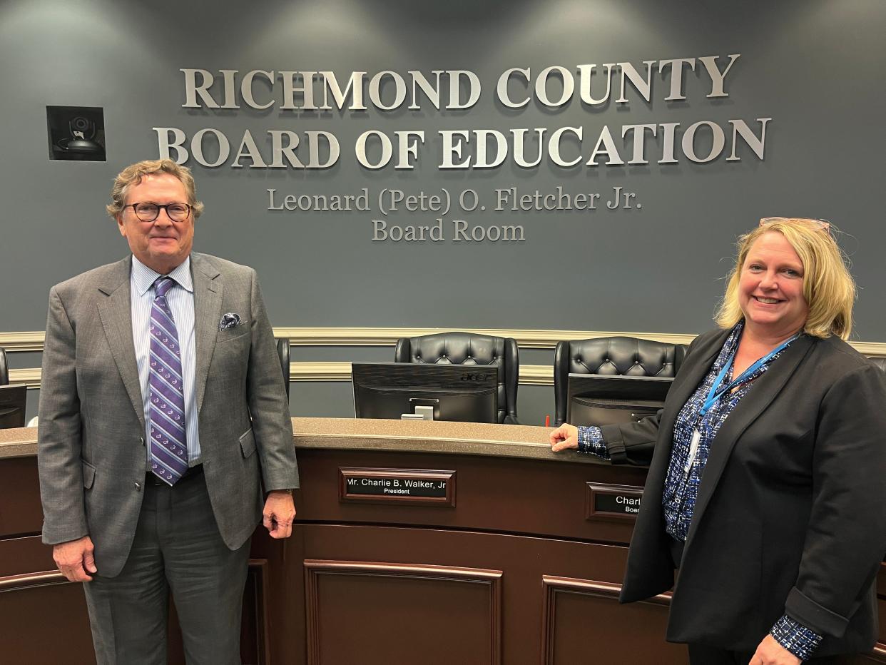 Larry Fletcher, left, and Kim Fletcher Bowden, right, were among the family members celebrating the late Richmond County Board of Education Attorney Leonard "Pete" Fletcher who was made the namesake of the board's auditorium on Tuesday, May 16, 2023.