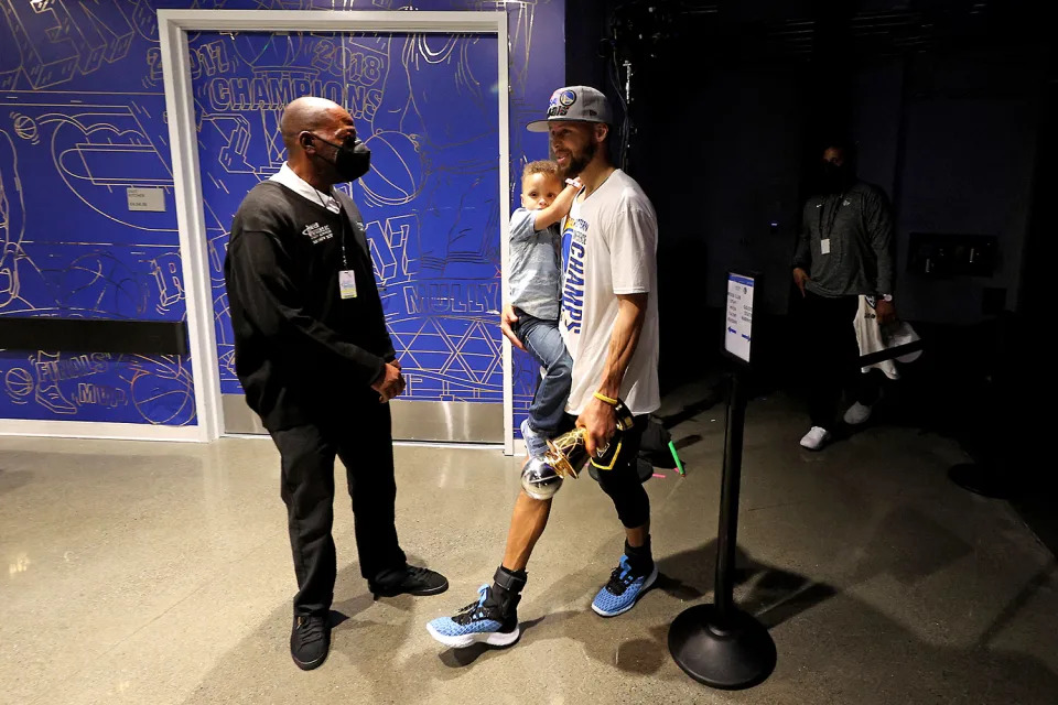 <p>Dad's little good luck charm! With a trophy in one hand and Canon in the other, Stephen walked off the court after a 120-110 win against the Dallas Mavericks in game five of the 2022 NBA Playoffs Western Conference Finals.</p>