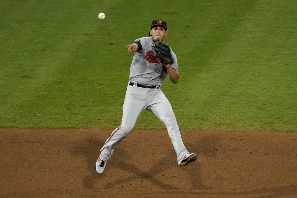 Baltimore Orioles third baseman Rio Ruiz throws to first after fielding a ground out by Philadelphia Phillies' Andrew McCutchen during the fifth inning of a baseball game, Tuesday, Aug. 11, 2020, in Philadelphia. (AP Photo/Matt Slocum)