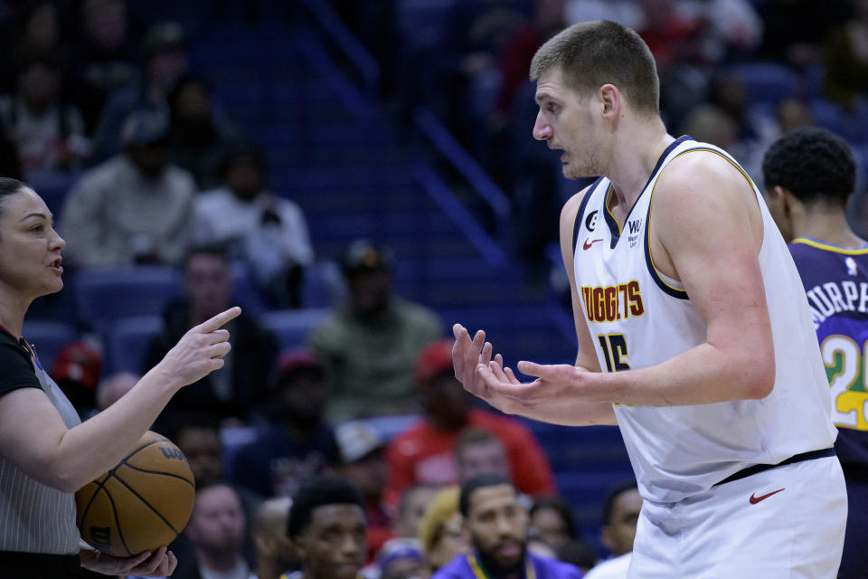 Denver Nuggets center Nikola Jokic (15) argues a call against him by referee Lauren Holtkamp-Sterling, left, during the first half of the team's NBA basketball game against the New Orleans Pelicans in New Orleans, Tuesday, Jan. 24, 2023. (AP Photo/Matthew Hinton)