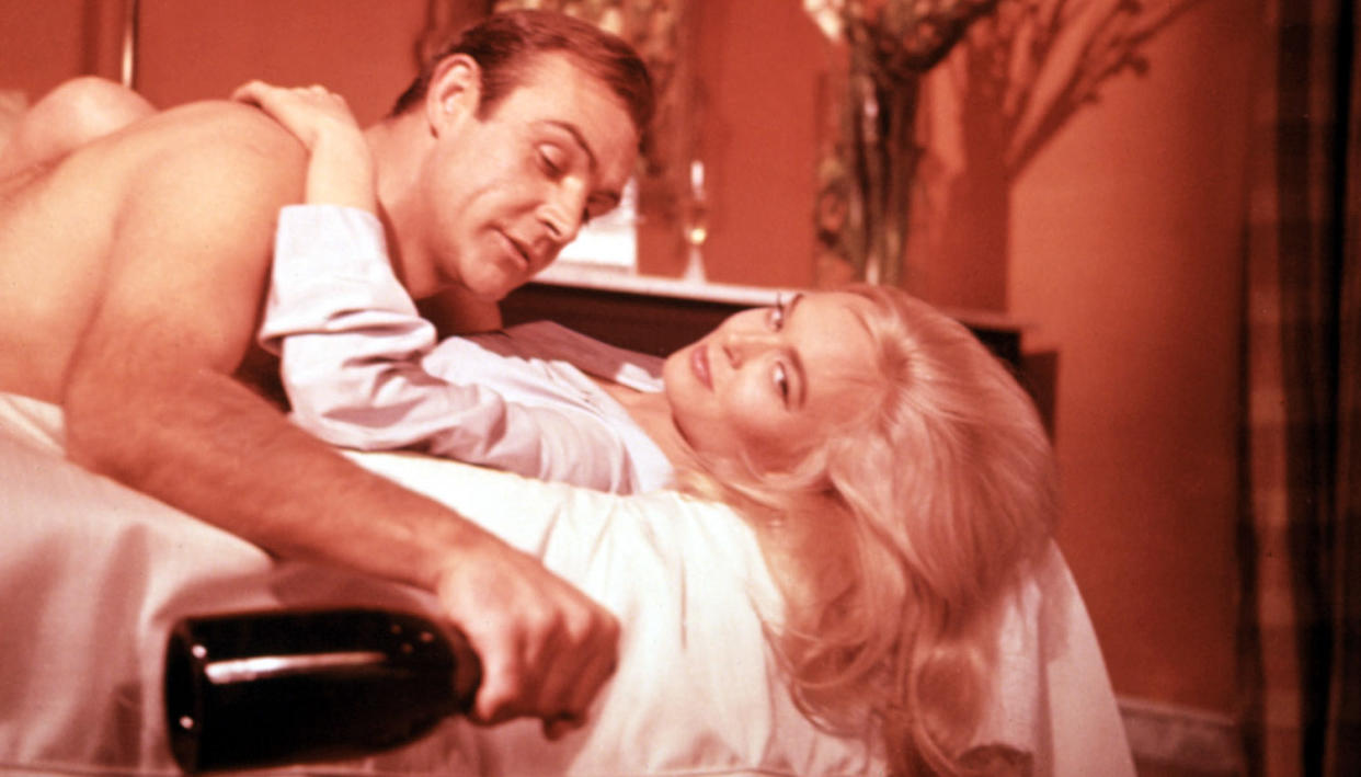 Sean Connery and Shirley Eaton in the 1964 James Bond adventure, Goldfinger (Photo: Courtesy Everett Collection)