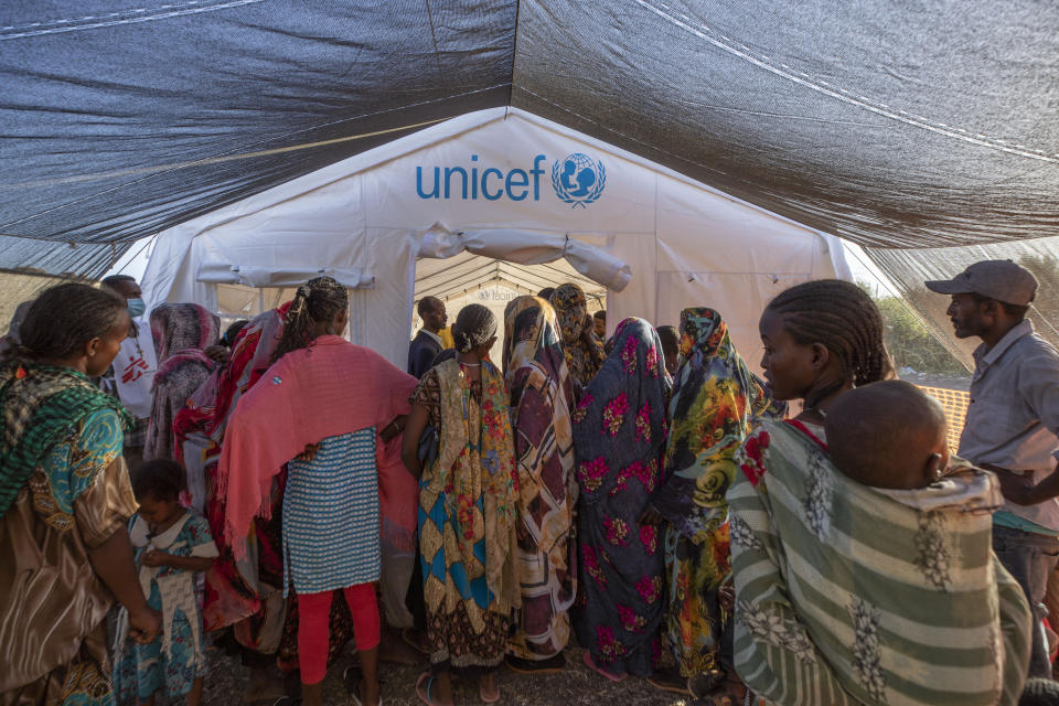 Tigray refugees who fled a conflict in the Ethiopia's Tigray region, wait to receive treatment at a clinic run by MSF (Doctors Without Borders) in Village 8, the transit center near the Lugdi border crossing, eastern Sudan, Tuesday, Dec. 8, 2020. (AP Photo/Nariman El-Mofty)