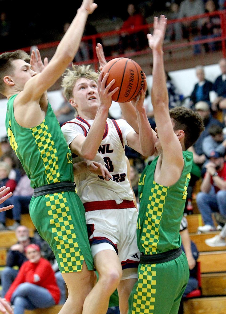 Bedford North Lawrence's Patric Matson (10) splits two Floyd Central defenders on his way to scoring 27 points. BNL defeated HHC foe Floyd Central 68-46 at the BNL Fieldhouse Thursday, Feb. 1, 2024. BNL, 11-5 after the win, faced Evansville Memorial Saturday afternoon.