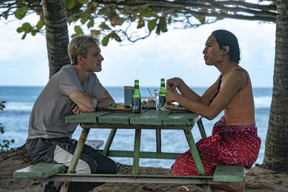 This image released by Searchlight Pictures shows Michael Fassbender, left, and Kaimana in a scene from "Next Goal Wins." (Hilary Bronwyn Gayle/Searchlight Pictures via AP)