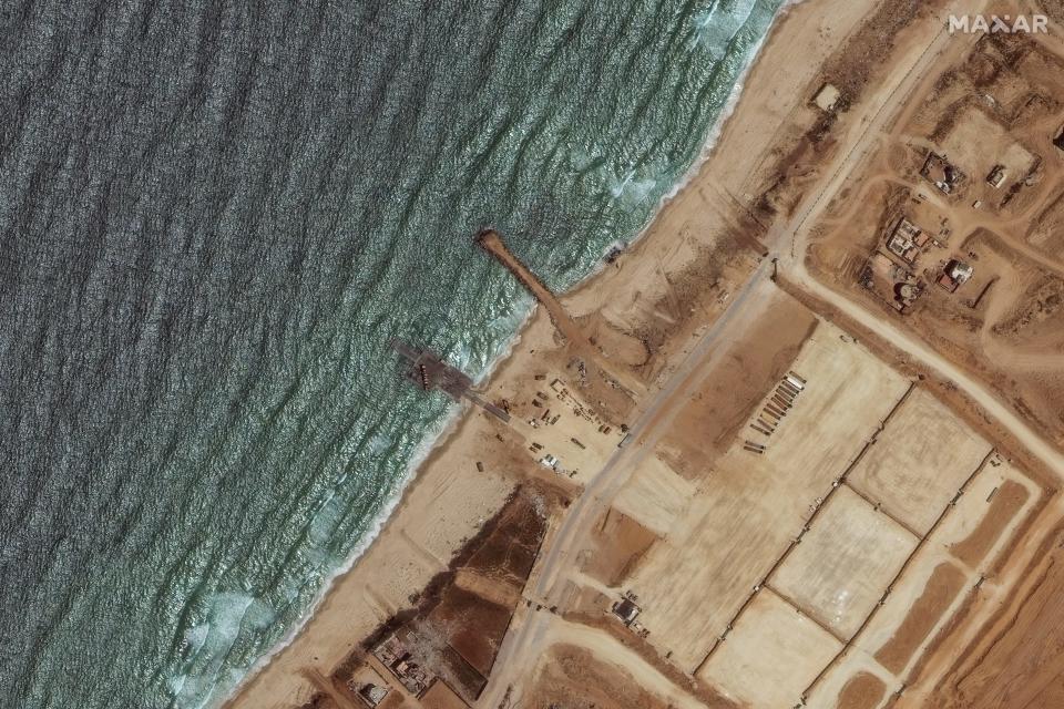 This handout satellite image courtesy of Maxar Technologies shows the remaining section of the US-built Trident Pier on the coast of Gaza on May 29, 2024.