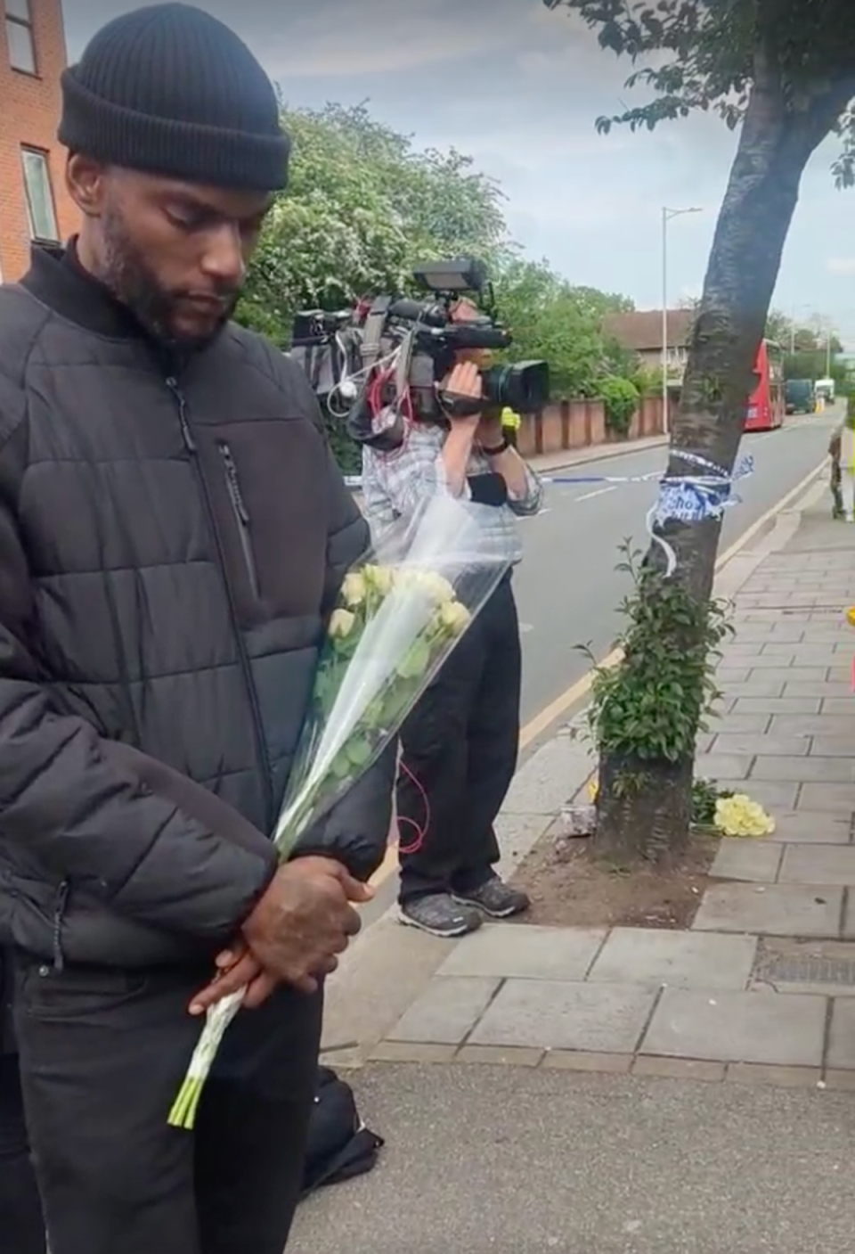 Faron Paul pays his respects to Daniel Anjorin in Hainault (Barney Davis/The Independent)