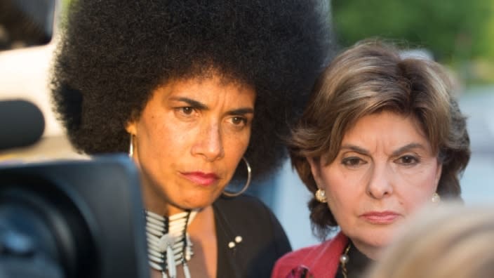 In this May 2015 photo, Lili Bernard (left) and Gloria Allred, her attorney at the time, talk with other protestors outside Bill Cosby’s “Far from Finished” Tour at Cobb Energy Performing Arts Center in Atlanta. (Photo: Marcus Ingram/Getty Images)