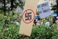 <p>A anti-Nazi sign stands as counter protesters gather at Freedom Plaza before the Unite the Right rally in Lafayette Park on August 12, 2018 in Washington, DC. Thousands of protesters are expected to demonstrate against the ‘white civil rights’ rally, which was planned by the organizer of last year’s deadly rally in Charlottesville, Virginia. (Photo: Alex Wroblewski/Getty Images) </p>