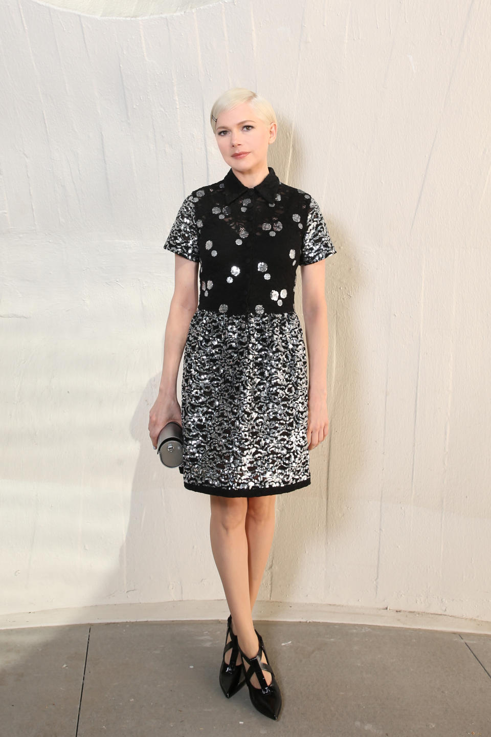 Michelle Williams wore a structured mini dress from Louis Vuitton for the Louis Vuitton Cruise 2020 show on 8 May. She opted for no jewellery but two single black clips holding back the fringe of her pixie cut. <em>[Photo: Getty]</em>