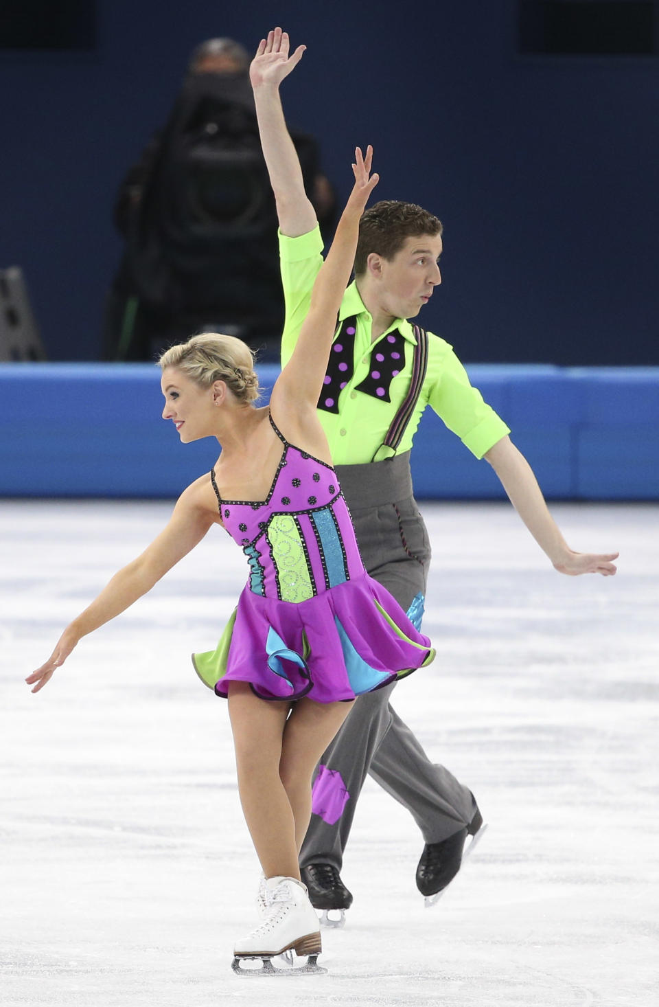 <p>The Australian pair also went the colorful route, but chose neon colors instead of pastel.And they didn’t just stop with blocks of bright purple, green and blue. They also added polka dots to her top and his bow tie as well. </p>
