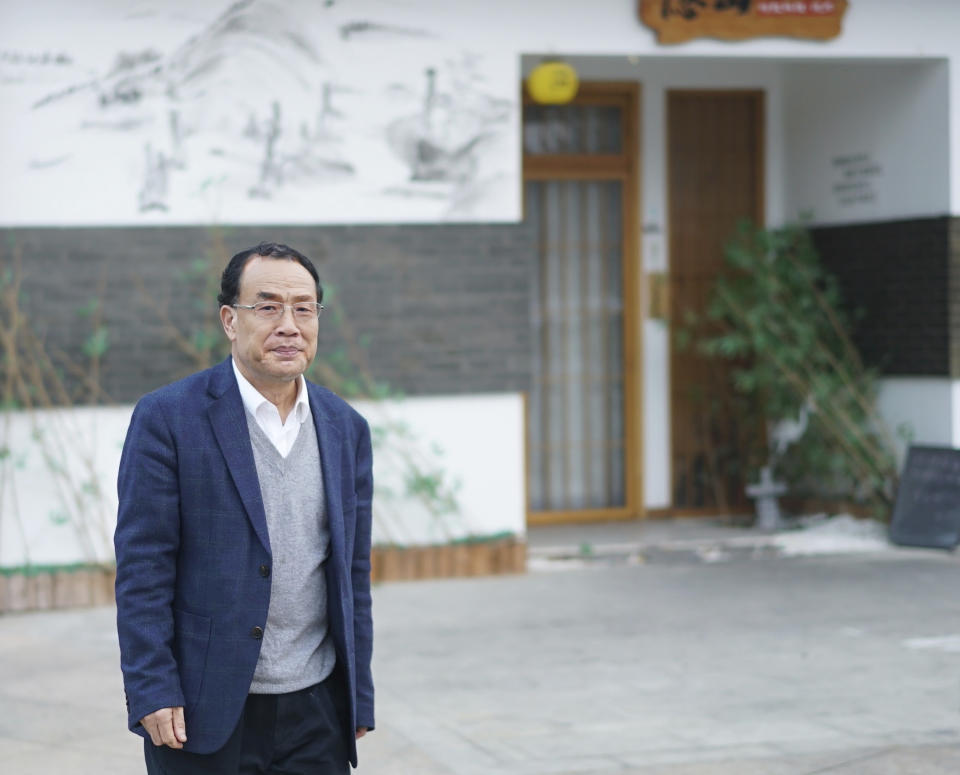 Virologist Zhang Yongzhen, the first scientist to publish a sequence of the COVID-19 virus, walks down a street in Shanghai, China on Dec. 13, 2020. Zhang was staging a sit-in protest after authorities locked him out of his lab. Zhang wrote in an online post on Monday, April 29, 2024, that he and his team were suddenly notified they were being evicted from their lab, the latest in a series of setbacks, demotions and ousters since he first published the sequence in early January 2020.(AP Photo/Dake Kang)