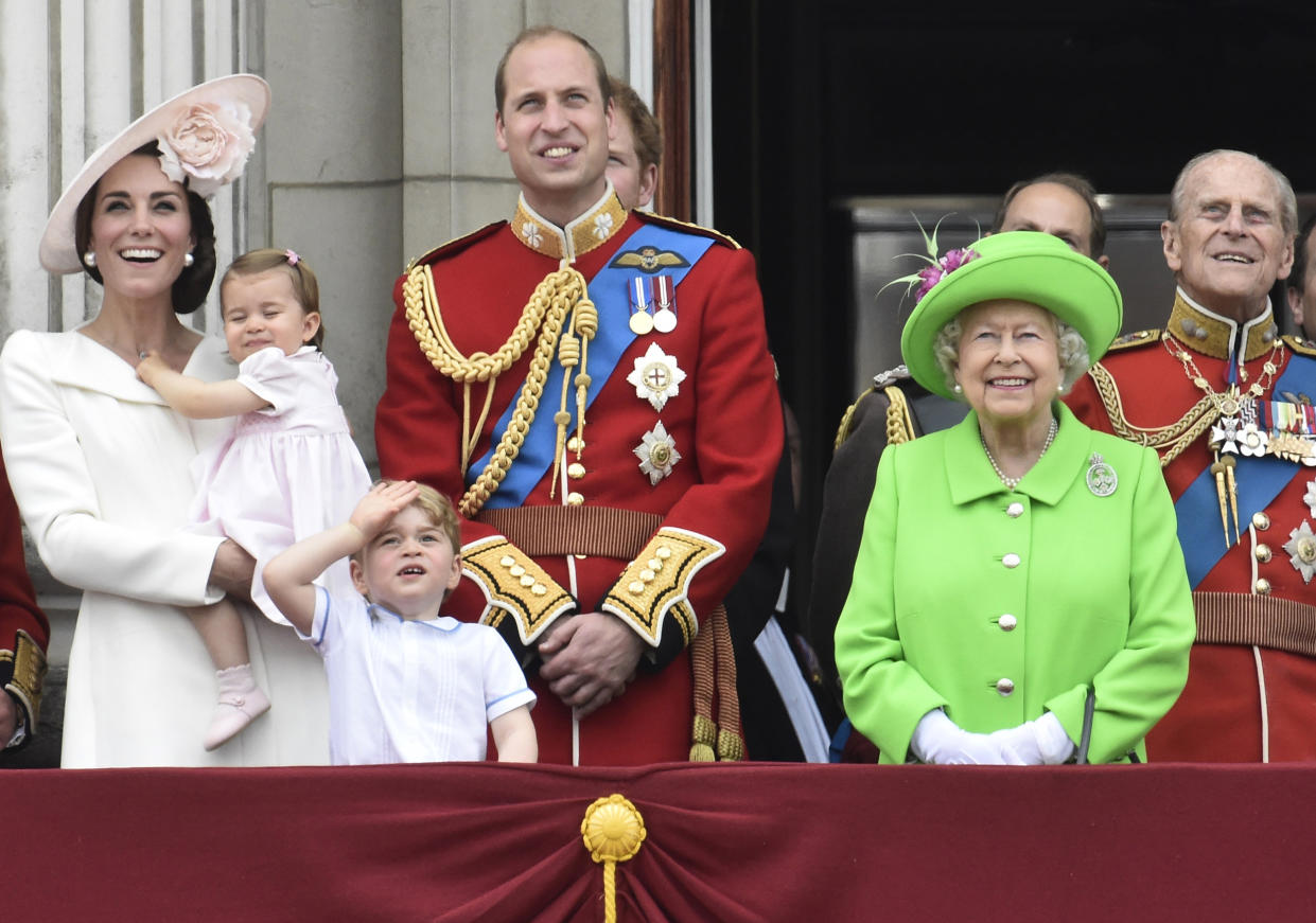 Members of the royal family stand on the balcony of Buckingham Palace in central London (Toby Melville / Reuters)