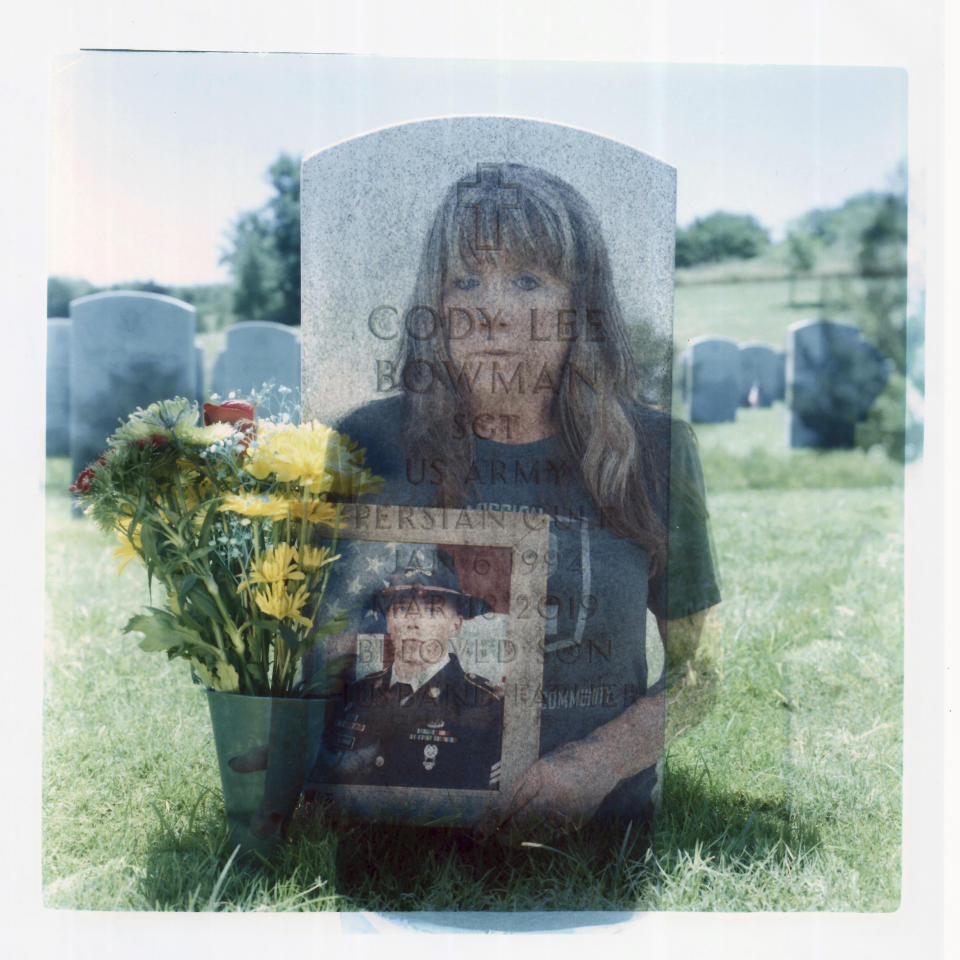 In this double exposure darkroom print made from two film negatives, a portrait of Barbie Rohde holding a photo of her son, Army Sgt. Cody Bowman, is layered with a photo of his tombstone at the Dallas-Fort Worth National Cemetery, Sunday, June 11, 2023, in Dallas. For decades, discussions of suicide prevention skirted fraught questions about firearms; the Army has punted implementing measures that might be controversial. But a growing movement has taken hold, among researchers, the Veterans Administration, ordinary people like Rohde: if this country wants to get serious about addressing an epidemic of suicide, it must find a way to honor veterans and active-duty military personnel, respect their rights to own a gun, but keep it out of their hands on their darkest days. She had been worried about her son. Most of his hand had been blown off in a training accident. He told his mom he didn't know if he could continue his military career, and all he'd ever wanted to be was a soldier. He asked for his guns, which she had been holding. She'd hesitated. But they were his, and this is Texas. Then the military officers said: "Your son Sgt. Cody Bowman died of a self-inflicted gunshot wound." "And I really don't remember the rest of the day," Rohde said. "I just sat on the floor and screamed." She didn't eat for six days. She decided she wanted to be with her son. "I'm glad I didn't have a gun. Because if I would have had a gun, I believe I'd have finished the job. I need to be here, I still have a lot to do," she said. "And I wish Cody wouldn't have had a gun." (AP Photo/David Goldman)