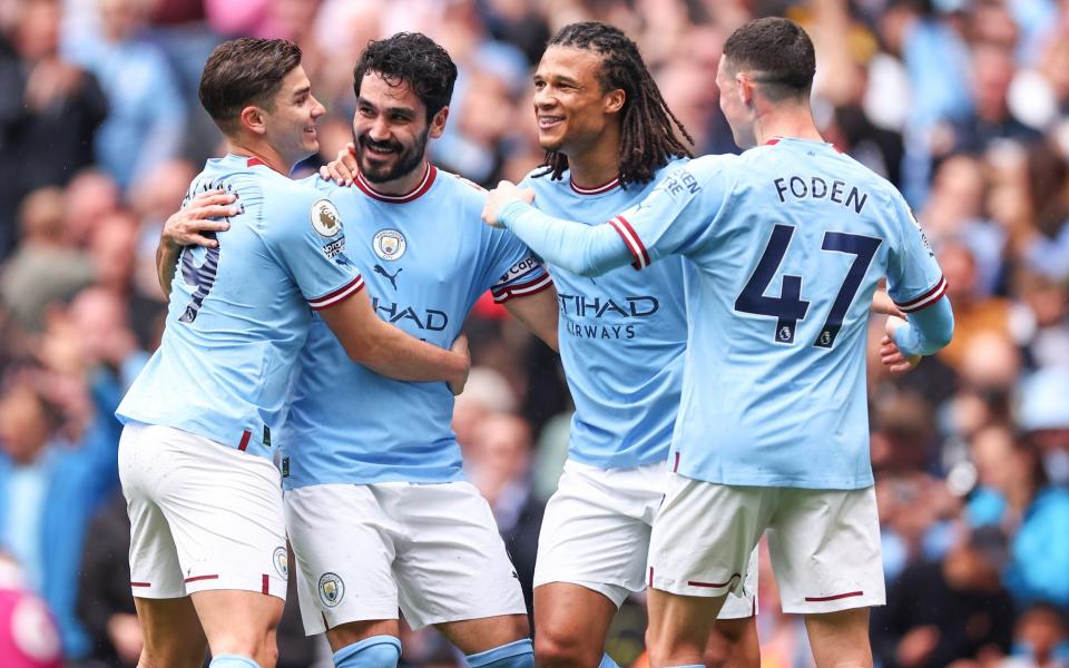 Ilkay Gundogan (second from left) scored both of City's goals but missed the penalty - Getty Images
