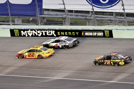 Nov 18, 2018; Homestead, FL, USA; NASCAR Cup Series driver Joey Logano (22), NASCAR Cup Series driver Kevin Harvick (4) and NASCAR Cup Series driver Martin Truex Jr. (78) during the Ford EcoBoost 400 at Homestead-Miami Speedway. Mandatory Credit: John David Mercer-USA TODAY Sports