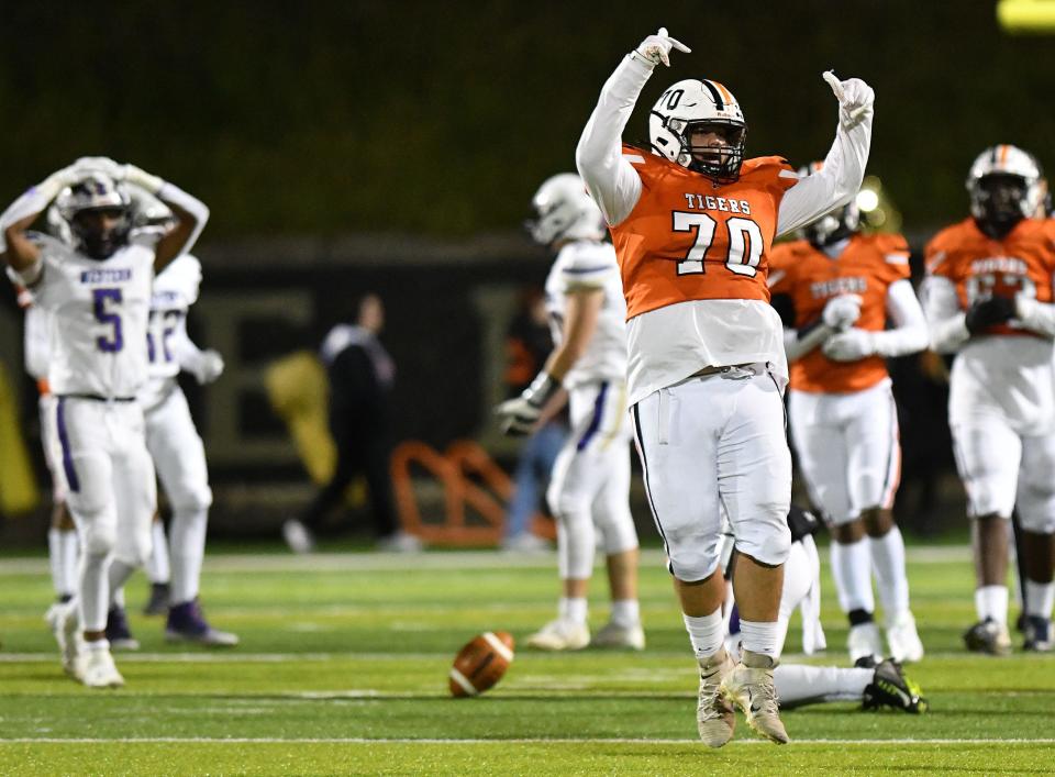 Beaver Falls' Damian Lee (70) celebrates after sacking Western Beaver quarterback Xander LeFebvre during Friday night's game at Reeves Field in Beaver Falls.