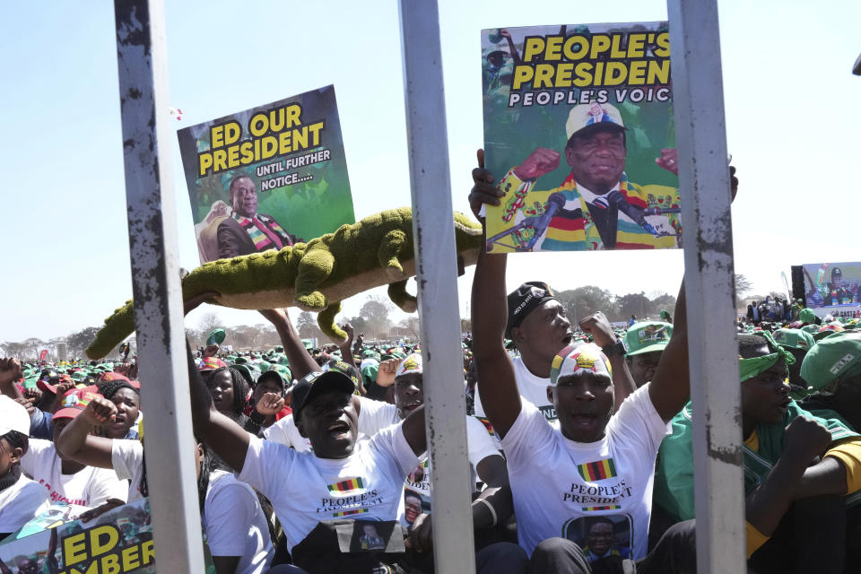 Supporters of Zimbabwean President Emmerson Mnangagwa are seen at a campaign rally in Harare, Wednesday, Aug. 9, 2023. Mnangagwa addressed thousands of supporters in a speech laden with calls for peace, days after his supporters were accused of stoning an opposition activist to death ahead of general elections set for Aug. 23. (AP Photo/Tsvangirayi Mukwazhi)