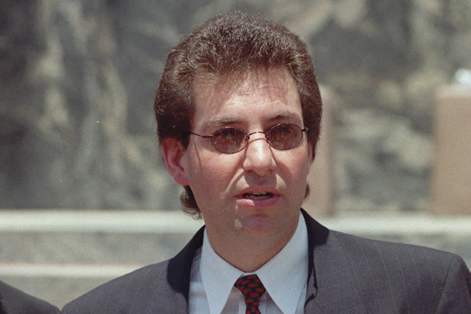 FILE - Master hacker Kevin Mitnick, who spent four years in federal prison for stealing computer secrets, talks to the media in Los Angeles Monday, June 26, 2000, after going to federal court to challenge a probation officer's order barring him from becoming a columnist for an Internet company. Mitnick, whose pioneering antics tricking employees in the 1980s and 1990s into helping him steal software and services from big phone and tech companies made him the most celebrated U.S. hacker, has died at age 59. (AP Photo/John Hayes, File)