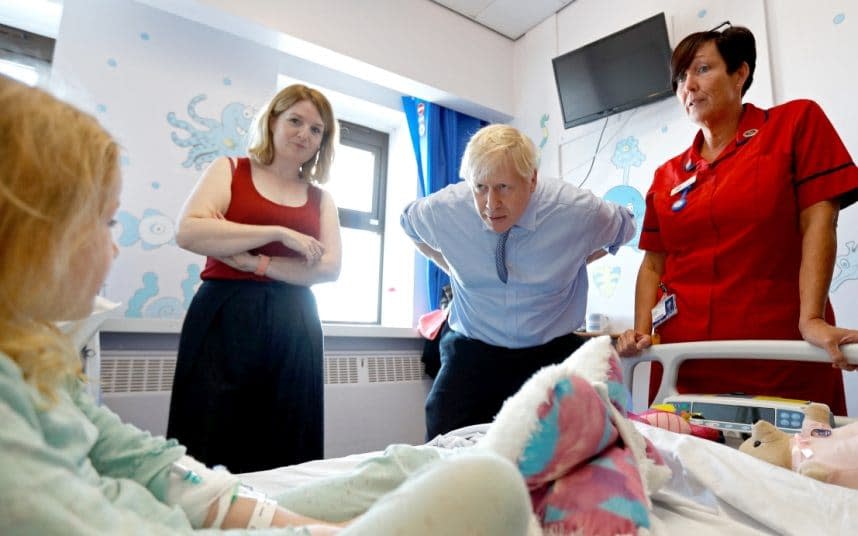 Bedside mannerisms | Boris Johnson meets Scarlett Gibbons, five, during a visit to the paediatric unit of the Royal Cornwall Hospital in Truro yesterday - 2019 Getty Images