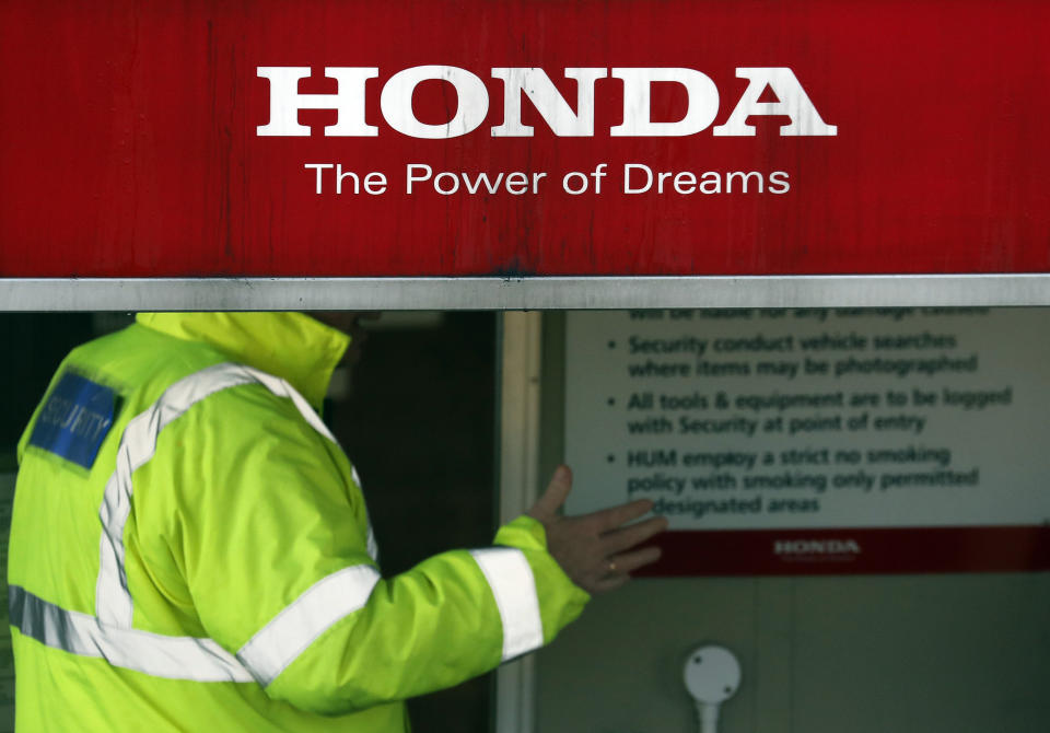 Security guards the entrance of the Honda car plant in Swindon, western England, Tuesday, Feb. 19, 2019. The Japanese carmaker Honda announced Tuesday that its car plant in Swindon will close with the potential loss of some 3,500 jobs.(AP Photo/Frank Augstein)