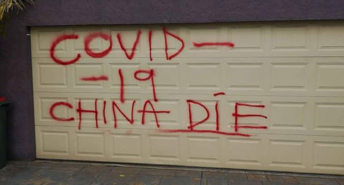 'COVID-19 China Die' is seen spray-painted on the garage of a Melbourne home.