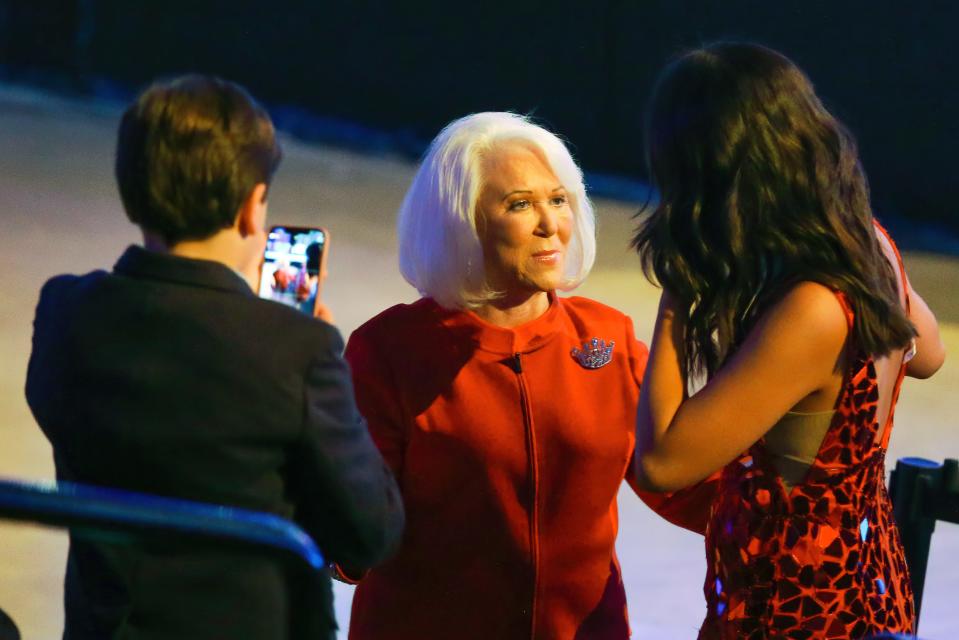 Jane Alderson talks with a friend before the pageant starts on Thursday, May 5, 2022, the second night of the inaugural Miss Volunteer America Pageant.