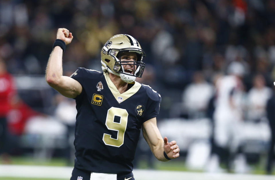 New Orleans Saints quarterback Drew Brees (9) reacts after throwing a touchdown pass to wide receiver Austin Carr, not pictured, in the first half of an NFL football game against the Atlanta Falcons in New Orleans, Thursday, Nov. 22, 2018. (AP Photo/Butch Dill)
