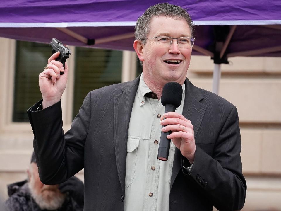 Rep Thomas Massie (R-KY) draws a Ruger LCP handgun from his pocket during a rally in support of the Second Amendment on January 31, 2020 in Frankfort, Kentucky.