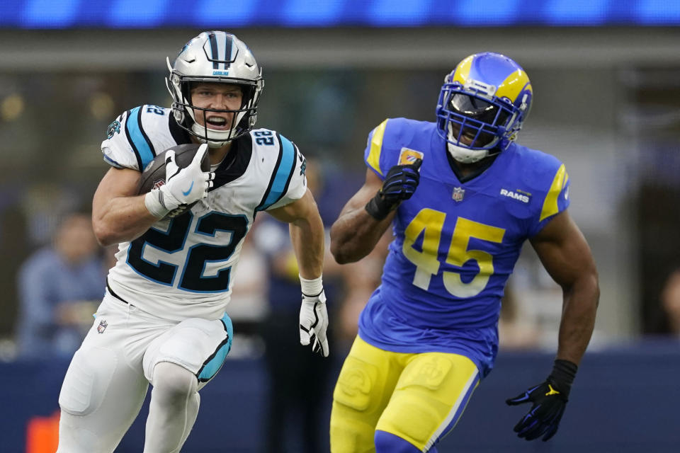 Carolina Panthers running back Christian McCaffrey (22) runs past Los Angeles Rams linebacker Bobby Wagner (45) during the second half of an NFL football game Sunday, Oct. 16, 2022, in Inglewood, Calif. (AP Photo/Ashley Landis)