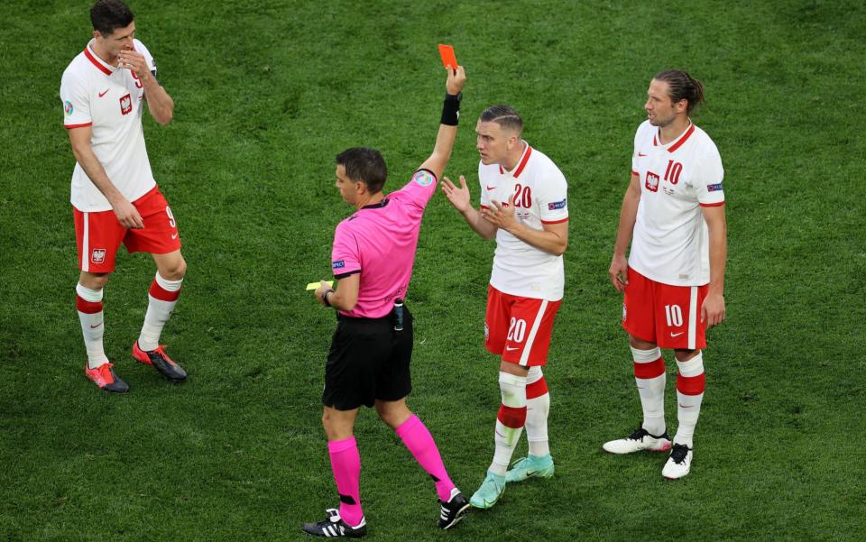 Grzegorz Krychowiak receives a classic no-look red card - GETTY IMAGES