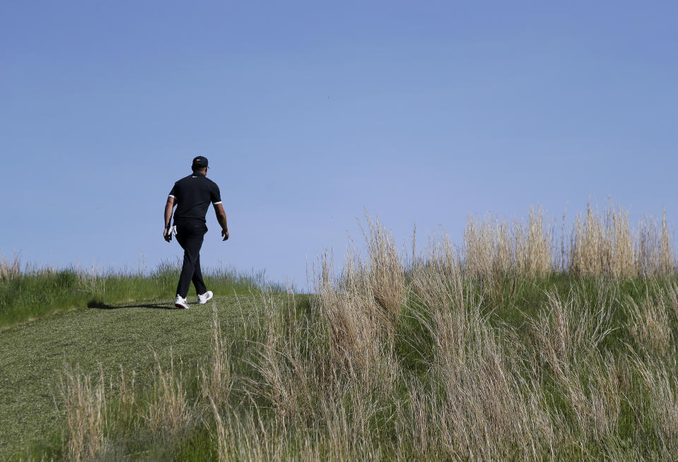 Brooks Koepka walks up to the 6th fairway during the third round of the PGA Championship golf tournament, Saturday, May 18, 2019, at Bethpage Black in Farmingdale, N.Y. (AP Photo/Seth Wenig)