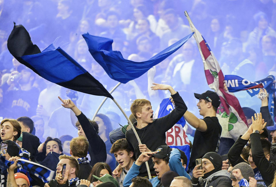 CF Montreal fans cheer on their team following a goal during second-half MLS soccer match action against the Philadelphia Union in Montreal, Saturday, March 18, 2023. (Graham Hughes/The Canadian Press via AP)