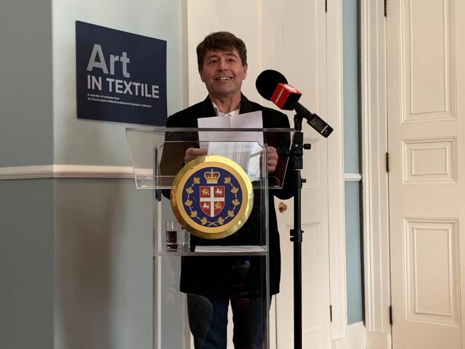 Michael Crummey stands in front of the crowd on behalf of his wife, the winner, Holly Hogan, who couldn't attend because she was out working at sea.