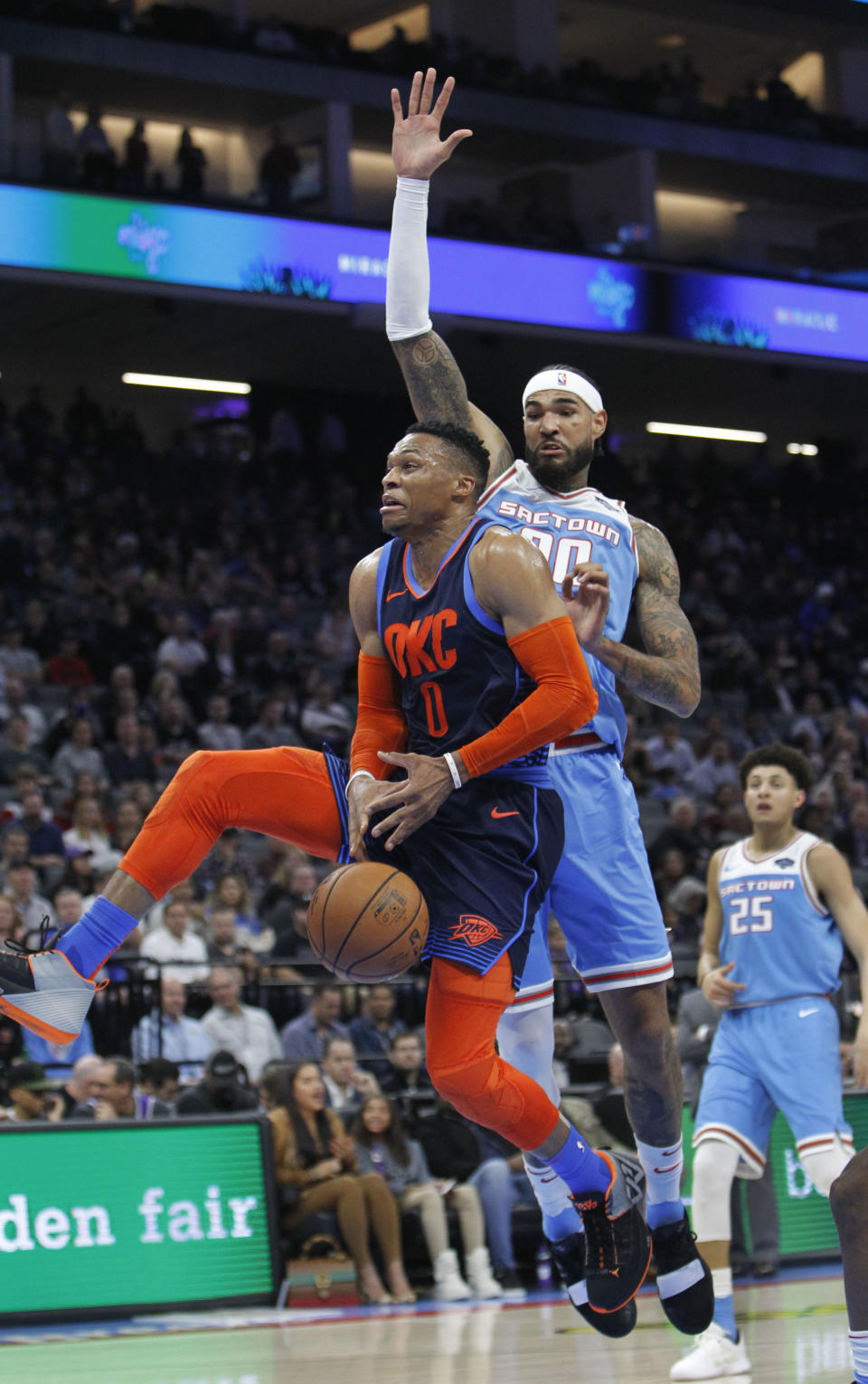 Oklahoma City Thunder guard Russell Westbrook (0) loses the ball while driving to the basket against Sacramento Kings center Willie Cauley-Stein (00) during the first half of an NBA basketball game in Sacramento, Calif., Wednesday, Dec. 19, 2018. (AP Photo/Steve Yeater)