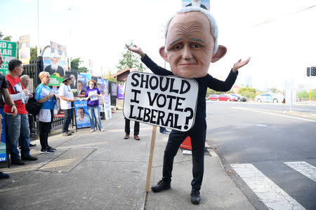 A protester dressed as former prime minister Malcolm Turnbull is seen at a polling place at Bellevue Hill, Sydney, Australia, October 20, 2018. AAP/Dan Himbrechts/via REUTERS