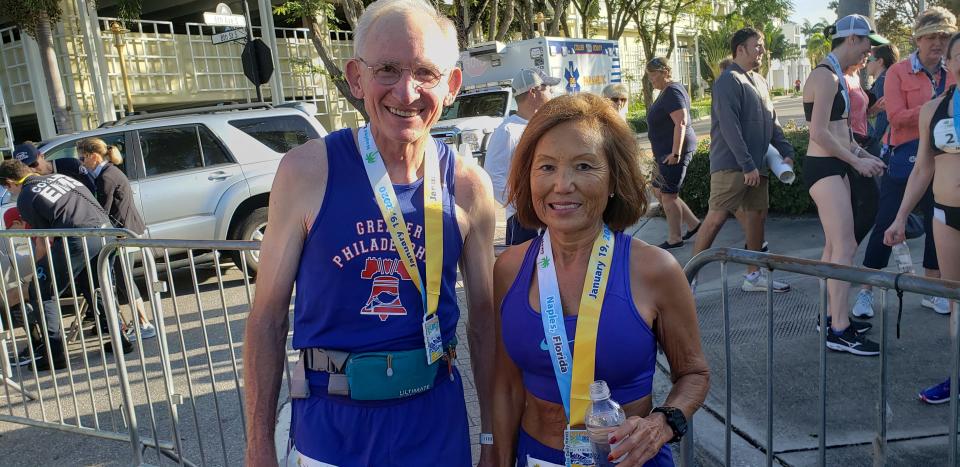 Gene Dykes (left), 71, and Jeannie Rice, 71, pose after finishing the 31st Naples Daily News Half Marathon on Sunday, Jan. 19, 2020. Dykes finished five seconds short of breaking his own American age group half-marathon record.