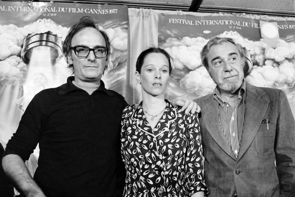 Carlos Saura (left) with Geraldine Chaplin and Fernando Rey at Cannes film festival in 1977.