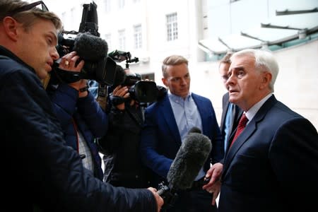 British Labour politician John McDonnell speaks to media outside the BBC headquarters after appearing on the Andrew Marr show in London