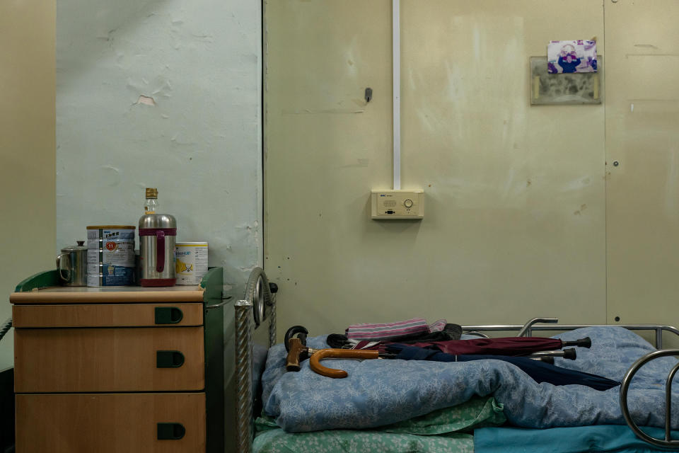 Personal effects left by a deceased resident, seen on a bed at Hong Kong's Kei Tak (Tai Hang) Home for the Aged.<span class="copyright">Anthony Kwan for TIME</span>