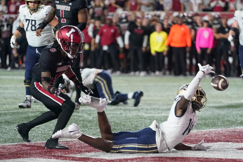 Akron wide receiver Jasaiah Gathings, right, cannot make a catch on a 2-point conversion pass against Indiana defensive back Phillip Dunnam during the fourth overtime, Saturday, Sept. 23, 2023, in Bloomington.