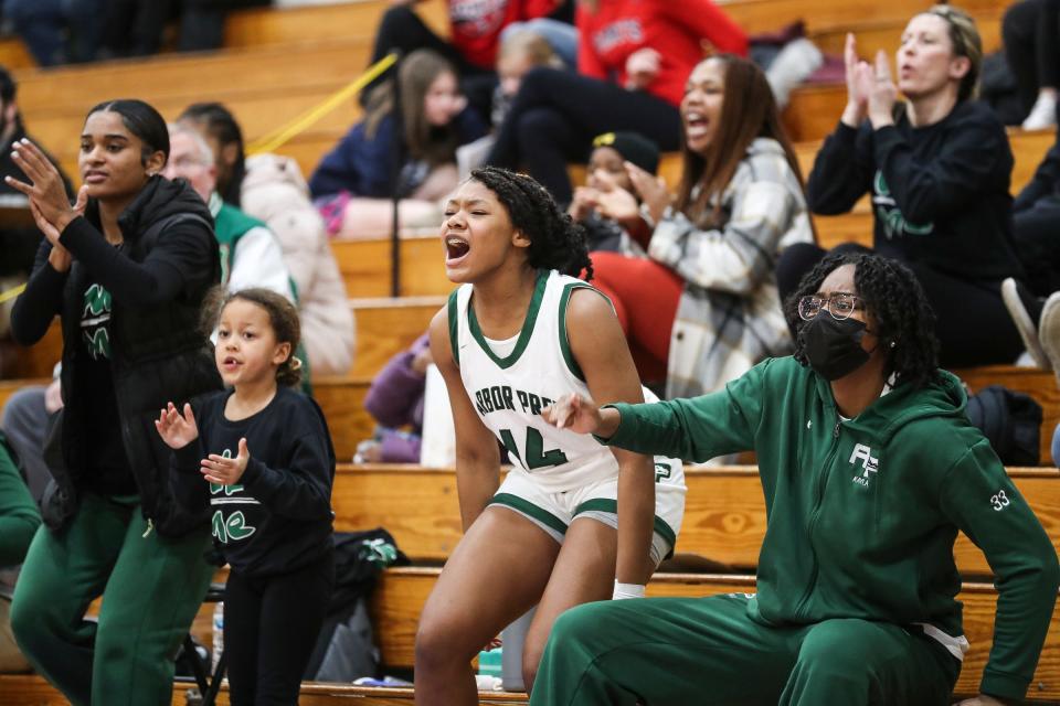 (From left) Ypsilanti Arbor Prep assistant coach Jibri Taylor's daughter Skylar Taylor, 7, center left, players Autumn Pernell, far left, Jourdin Lewis (14), center right, and Kayla Covington cheer for the Gators during the second half of Arbor Prep's 50-42 win in the MHSAA Division 3 regional semifinal at Concord High School on Tuesday, March 7, 2023.